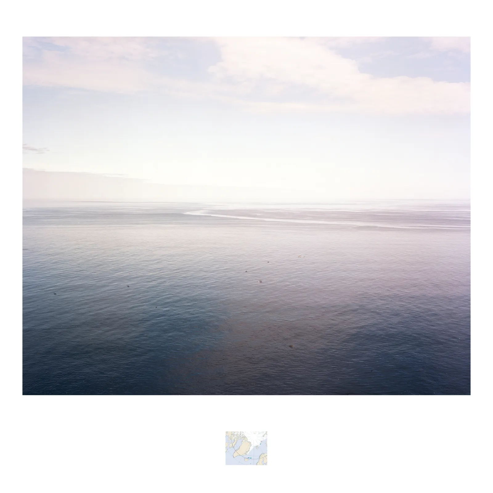An photograph of a seascape viewed from the island of Grímsey facing east into the Arctic Circle.
